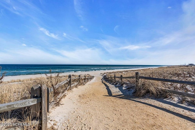 property view of water featuring a beach view