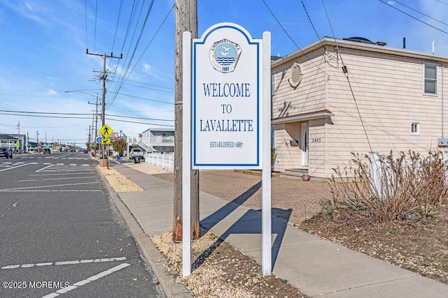 exterior space featuring street lights, traffic signs, and sidewalks