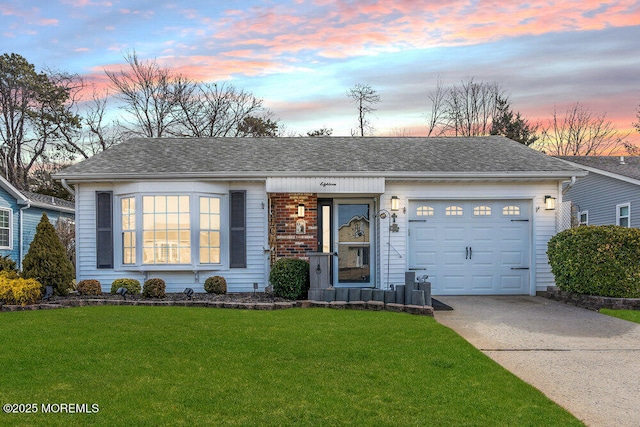 ranch-style house with brick siding, a front lawn, roof with shingles, a garage, and driveway