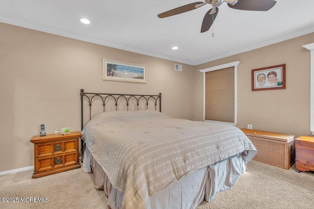 bedroom featuring ornamental molding, baseboards, visible vents, and light carpet