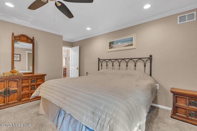 bedroom with ornamental molding, recessed lighting, visible vents, and light carpet