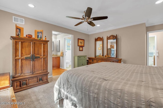 bedroom with visible vents, recessed lighting, light carpet, crown molding, and connected bathroom