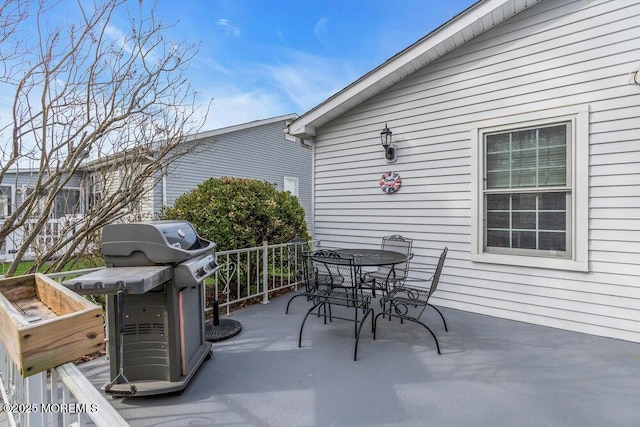 view of patio / terrace featuring outdoor dining space and a grill