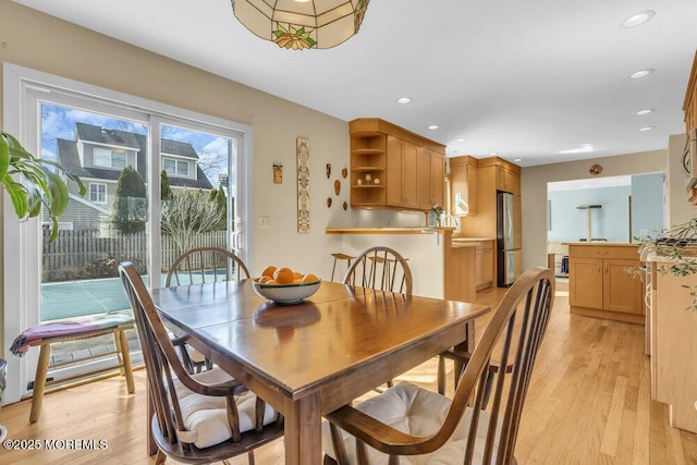 dining room featuring recessed lighting and light wood-style floors