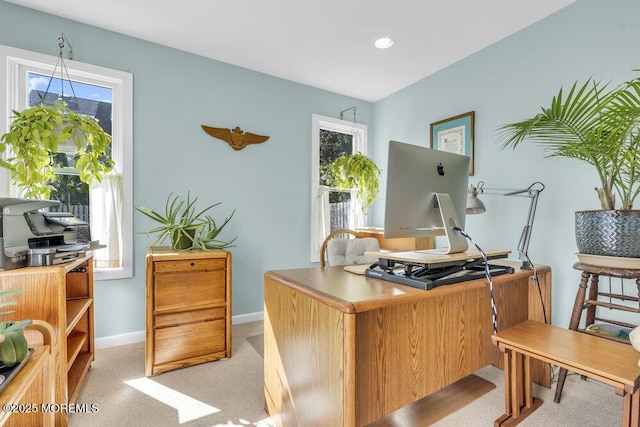 home office featuring light carpet and baseboards