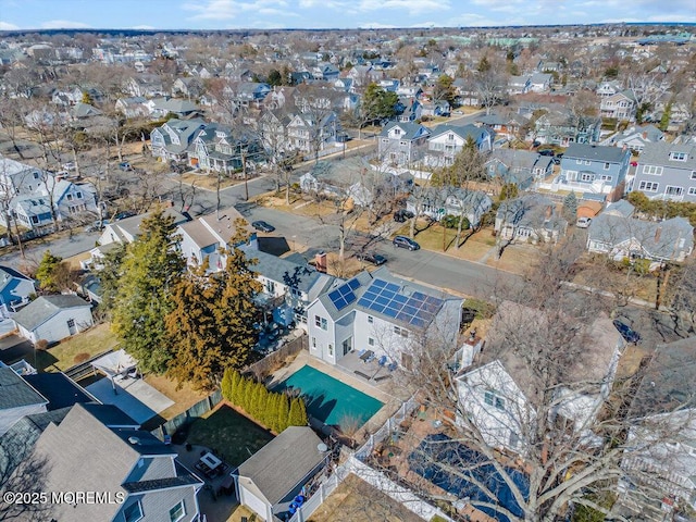 birds eye view of property with a residential view