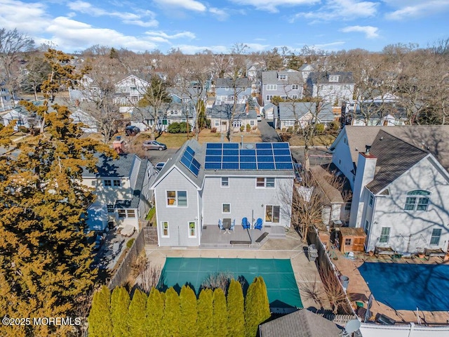 birds eye view of property with a residential view