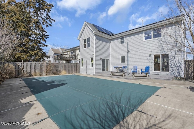 view of swimming pool with fence, a fenced in pool, and a patio