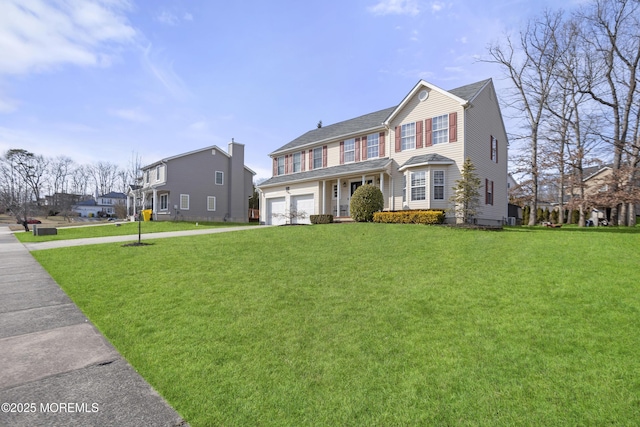 view of front facade with an attached garage and a front yard