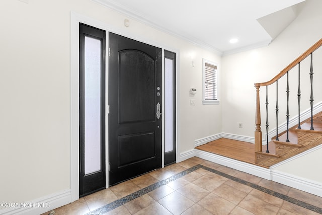 foyer entrance featuring stairway, recessed lighting, baseboards, and ornamental molding