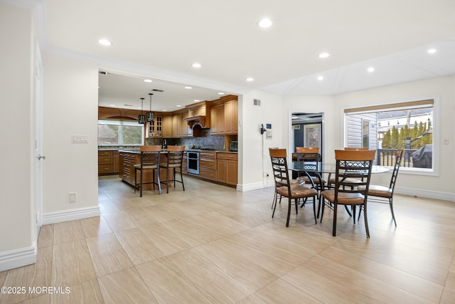 dining room with recessed lighting, visible vents, and baseboards