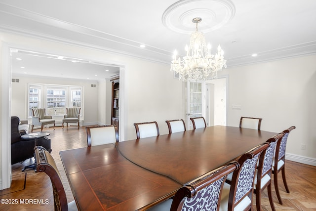 dining room with baseboards, ornamental molding, and recessed lighting