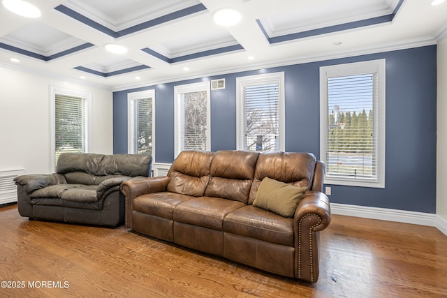 living area with coffered ceiling, wood finished floors, visible vents, and baseboards