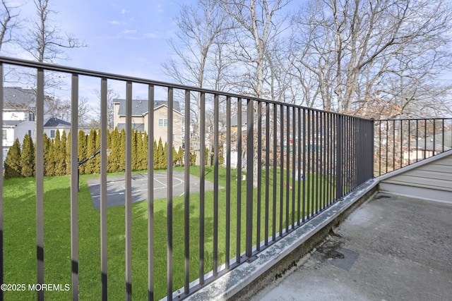 view of gate with a residential view and a yard