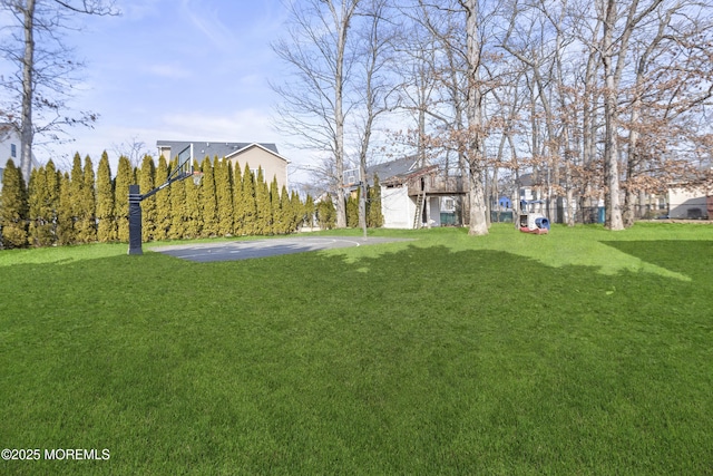 view of yard with community basketball court