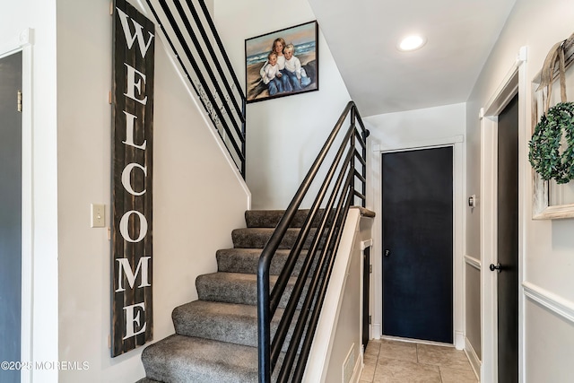 stairs featuring visible vents and recessed lighting