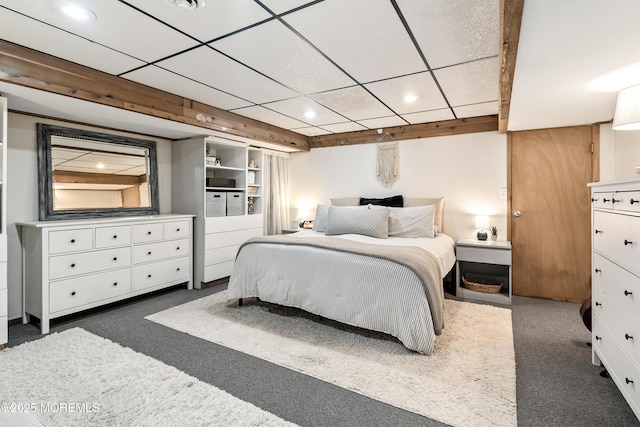 carpeted bedroom featuring a drop ceiling and recessed lighting