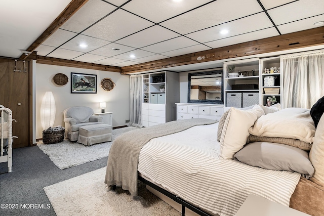 carpeted bedroom featuring a drop ceiling and recessed lighting