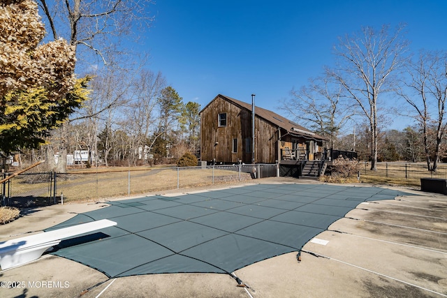 view of swimming pool featuring a deck, a patio, fence, and a fenced in pool