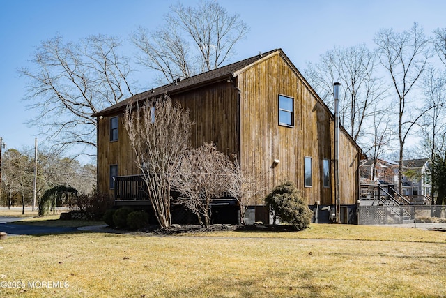 view of side of property with a yard