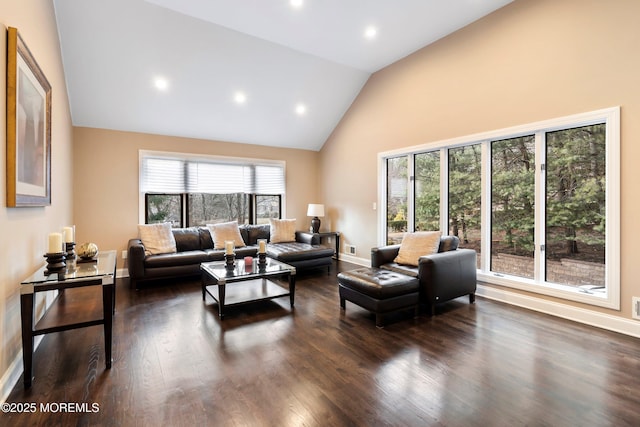 living area featuring baseboards, high vaulted ceiling, dark wood finished floors, and recessed lighting