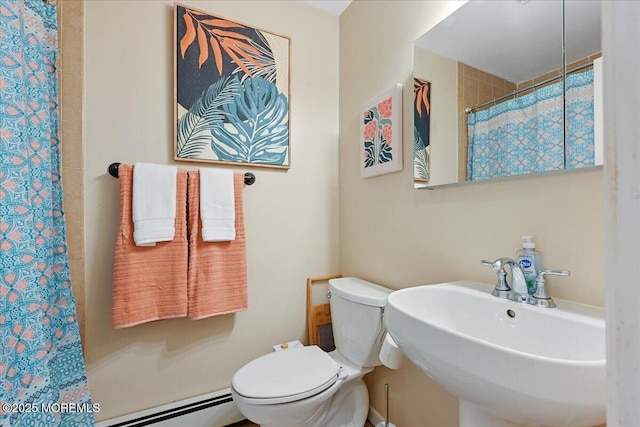 full bathroom with toilet, a shower with shower curtain, a sink, and baseboard heating