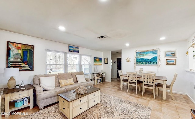 living room with light tile patterned floors, baseboards, visible vents, and recessed lighting