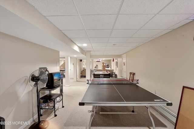 game room with carpet, a paneled ceiling, and baseboards