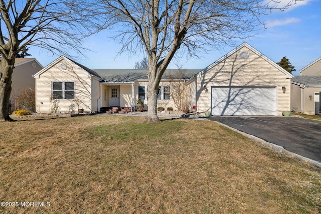 single story home with driveway, an attached garage, and a front lawn