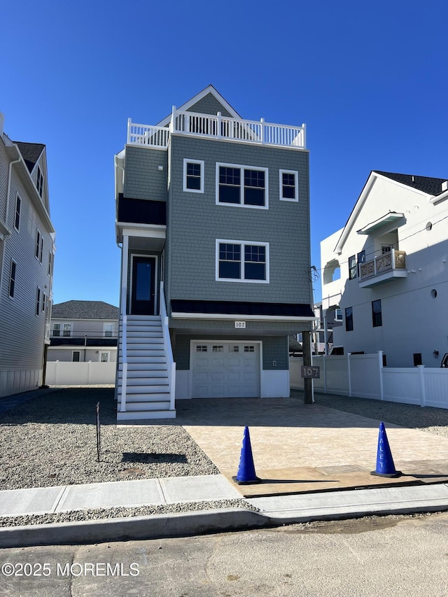 view of front of house featuring stairs and driveway