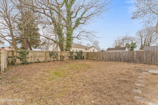 view of yard with a fenced backyard