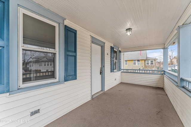 unfurnished sunroom featuring wooden ceiling