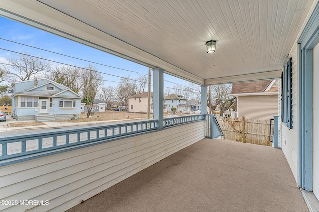 balcony with covered porch and a residential view