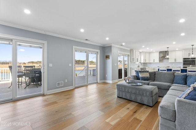 45 Royal Dr, Brick, NJ 08723 - living room featuring light wood-style flooring, crown molding, and recessed lighting