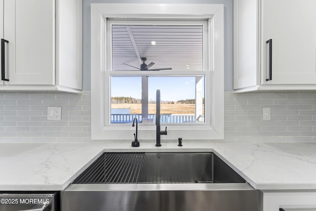 45 Royal Dr, Brick, NJ 08723 - kitchen featuring white cabinetry, decorative backsplash, light stone counters, and ceiling fan