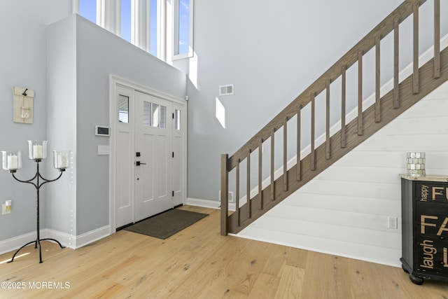 45 Royal Dr, Brick, NJ 08723 - foyer entrance featuring stairway, a towering ceiling, and wood finished floors