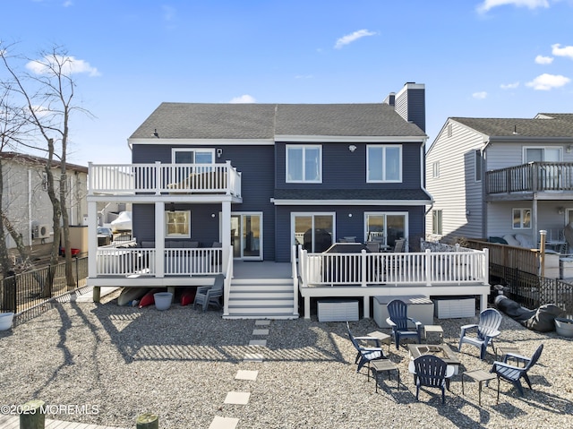 45 Royal Dr, Brick, NJ 08723 - rear view of property with an outdoor fire pit, roof with shingles, a balcony, and a deck