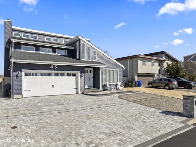 view of front of property with decorative driveway