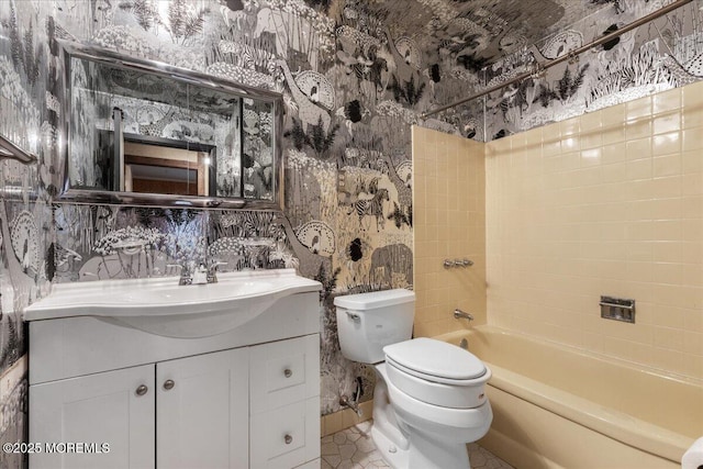 bathroom with shower / bathing tub combination, toilet, vanity, tile patterned flooring, and wallpapered walls