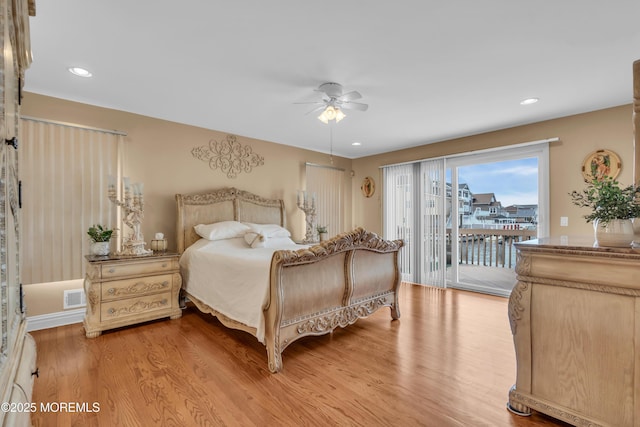 bedroom with light wood-style floors, access to outside, visible vents, and a ceiling fan