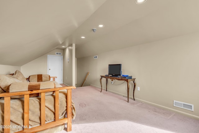 bedroom with lofted ceiling, carpet floors, visible vents, and baseboards