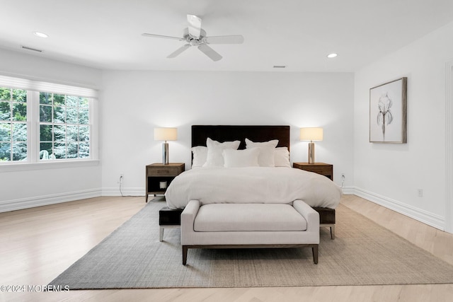 bedroom featuring recessed lighting, visible vents, baseboards, and wood finished floors