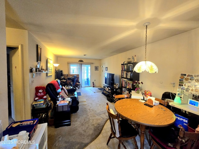 view of carpeted dining area