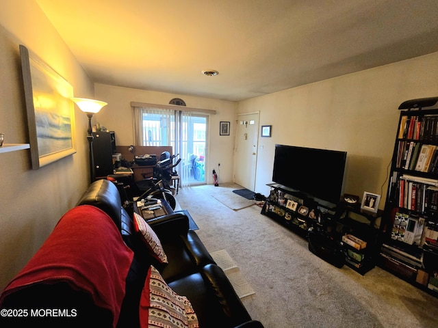 living area with carpet flooring and visible vents