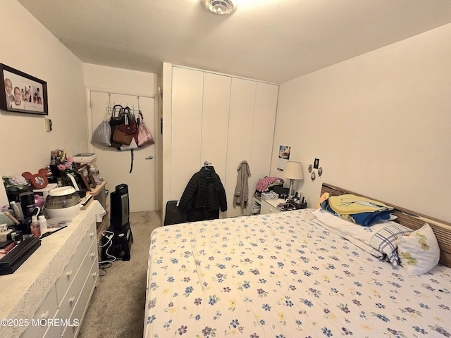 carpeted bedroom with a closet