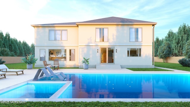 back of property featuring a fenced in pool, fence, a patio, and stucco siding