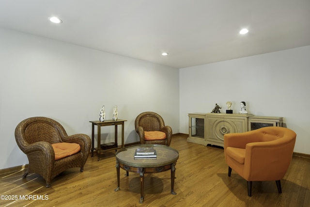 sitting room with light wood-style floors, baseboards, and recessed lighting