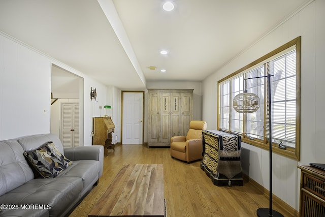 living room featuring light wood-style flooring and recessed lighting