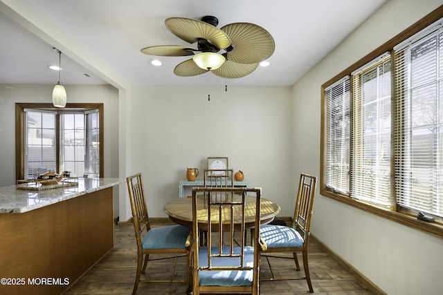 dining room featuring baseboards, recessed lighting, dark wood finished floors, and a healthy amount of sunlight