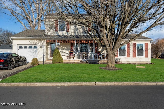 view of front of property featuring a garage, covered porch, and a front lawn